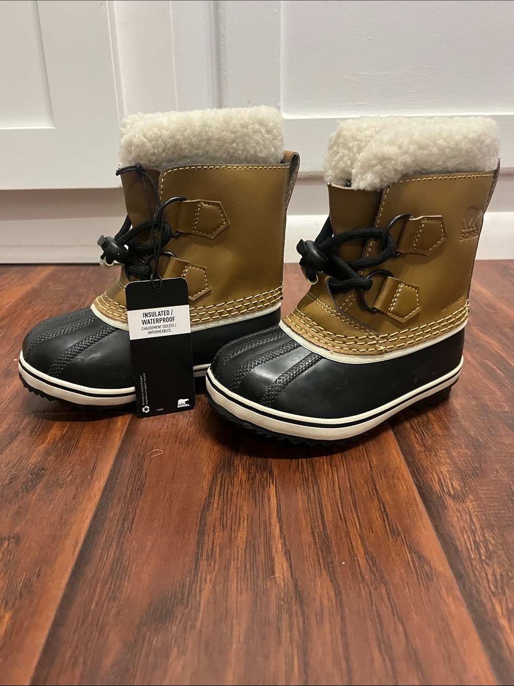 Sorel Kids Waterproof Snow Boots in Tan and Black with Faux Shearling Cuff